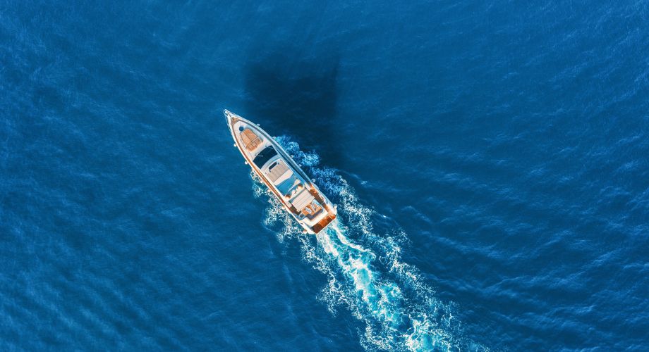 Introduction to Yacht Design | YATCO Cruising Luxury Yacht in the ocean. Explore the art and science of yacht design, from history and principles to trends, innovations, and creating luxury yachts.