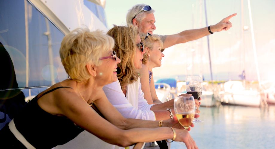 Yacht Investment | YATCO A group of people enjoying their time on a yacht. Is yacht investment worth it? Discover ownership models, charter income tips, & how to make yacht purchases work for your business goals.