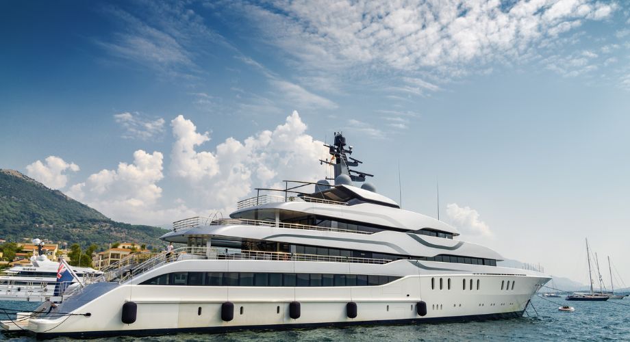 Yacht Sizes | YATCO A mega yacht sailing in the ocean. Confused about yacht sizes? Discover the right fit for you—from small luxury yachts to superyachts—explore types, prices, and yacht lengths.